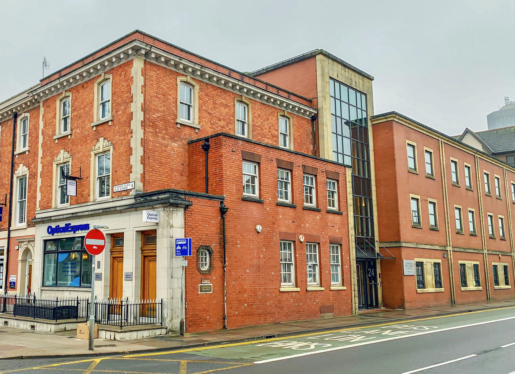 Exterior image of red brick buildings on corner of Windsor Place